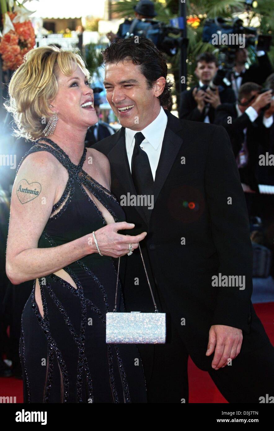 (dpa) - Hollywood couple Antonio Banderas and Melanie Griffith pose ahead of the screening of the animated movie 'Shrek 2' during the 57th Film Festival in Cannes, France, 15 May 2004. Antonio Banderas is the voice of 'Puss-in-Boots' in the second film with the green monster. 'Shrek 2' runs in competition for the Golden Palm award. Stock Photo