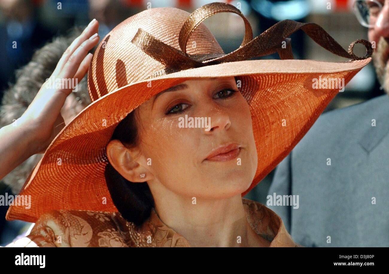(dpa) - Mary Donaldson, the Australian fiancee of Crown Prince Frederik of Denmark, holds on to her hat which had been blown off her head during a visit of the Parliament in Copenhagen, Denmark, 13 May 2004. Donaldson will wed Crown Prince Frederik at the Cathedral in Copenhagen on Friday 14 May 2004. Stock Photo