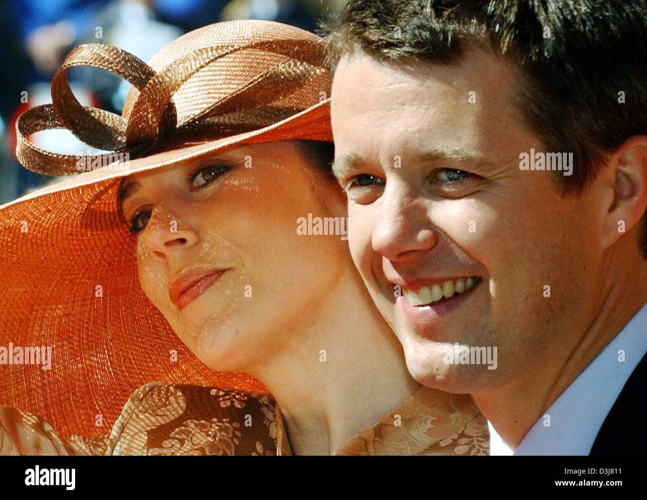 (dpa) - Crown Prince Frederik of Denmark and his Australian fiancee Mary Donaldson smile during a visit of the Parliament in Copenhagen, Denmark, 13 May 2004. Crown Prince Frederik and Donaldson will get married at the Cathedral in Copenhagen on Friday 14 May 2004. Stock Photo