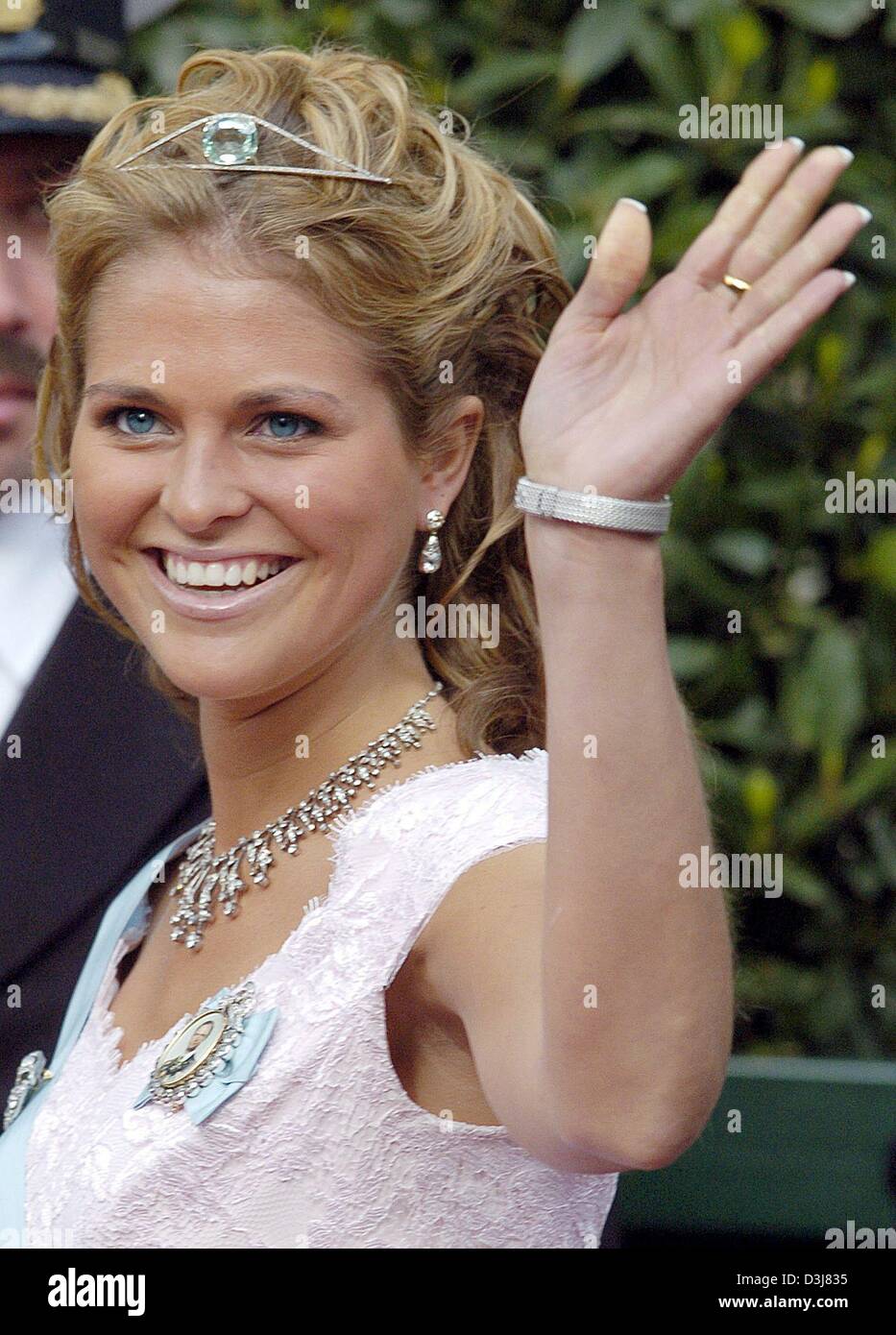 (dpa) - Swedish princess Madeleine smiles and waves her hand as she leaves the cathedrale after the wedding of Danish crown prince Frederik and Mary Donaldson in Copenhagen, Denmark, Friday, 14 May 2004. Members of all European royal dynasties were among the 800 invited guests who attended the wedding. Stock Photo