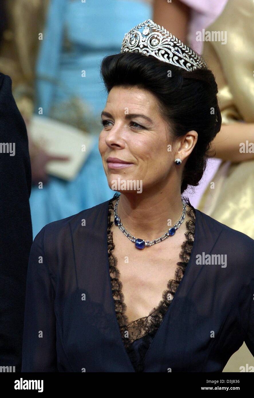 (dpa) - Princess Caroline of Monaco smiles on her arrival to the wedding of Danish crown prince Frederik and Mary Donaldson at the cathedrale in Copenhagen, Denmark, Friday, 14 May 2004. Members of all European royal dynasties were among the 800 invited guests who attended the wedding. Stock Photo