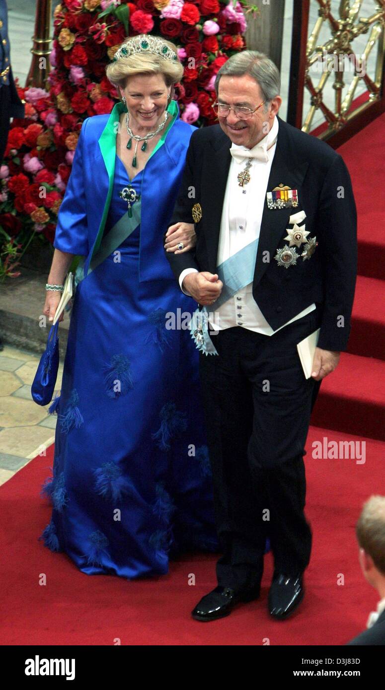 (dpa) - Former King of Greece Konstantin II (R) and his wife Anne-Marie smile on their arrival to the wedding of Danish crown prince Frederik and Mary Donaldson at the cathedral in Copenhagen, Denmark, Friday, 14 May 2004. Members of all European royal dynasties were among the 800 invited guests who attended the wedding. Stock Photo