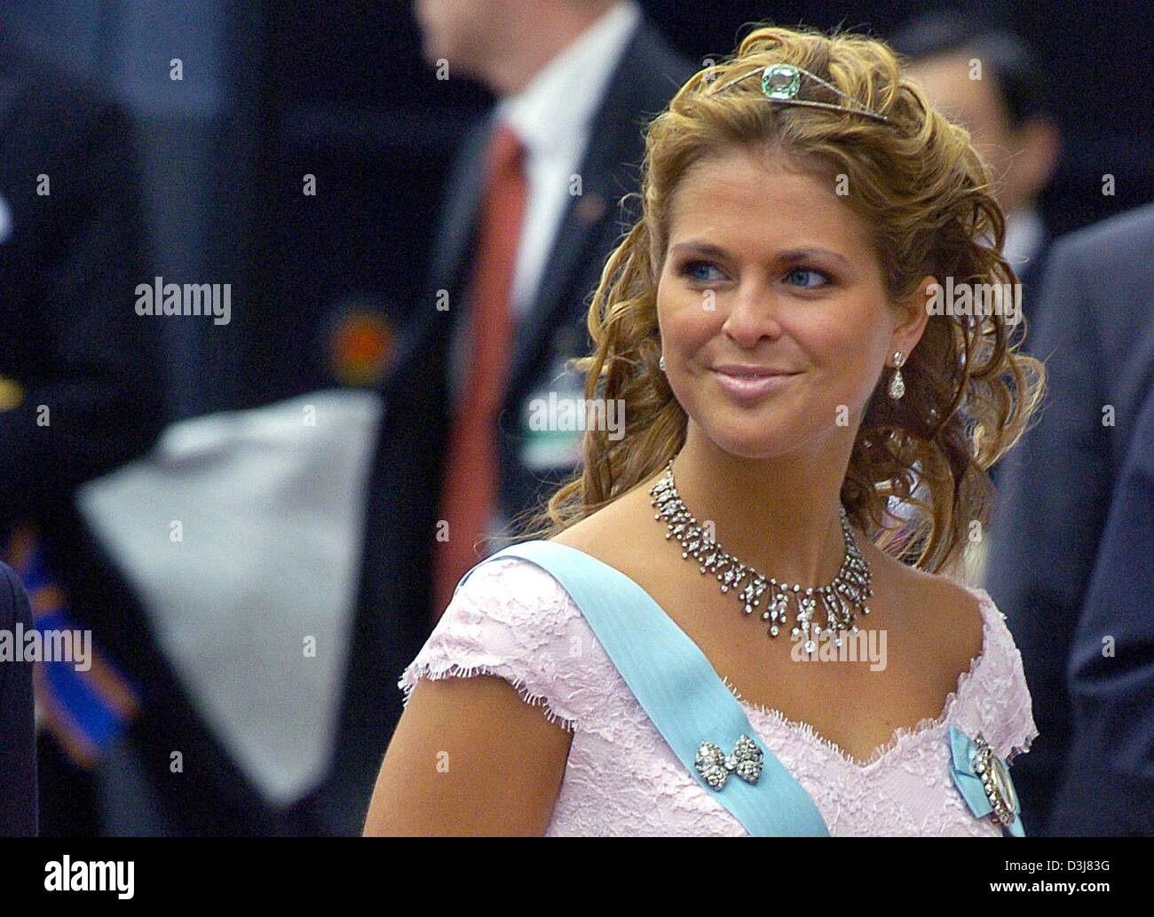 (dpa) - Swedish princess Madeleine smiles on her arrival to the wedding of Danish crown prince Frederik and Mary Donaldson at the cathedral in Copenhagen, Denmark, Friday, 14 May 2004. Members of all European royal dynasties were among the 800 invited guests who attended the wedding. Stock Photo