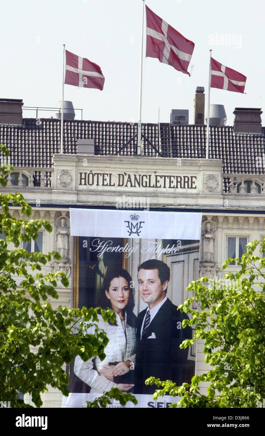 (dpa) - A giant poster depicting the the bridal couple crown prince Frederik of Denmark and Mary Donaldson hangs from the facade of a hotel in Copenhagen, Denmark, 11 May 2004. The preparations for the royal wedding, on Friday, 14 May 2004, are underway. Stock Photo