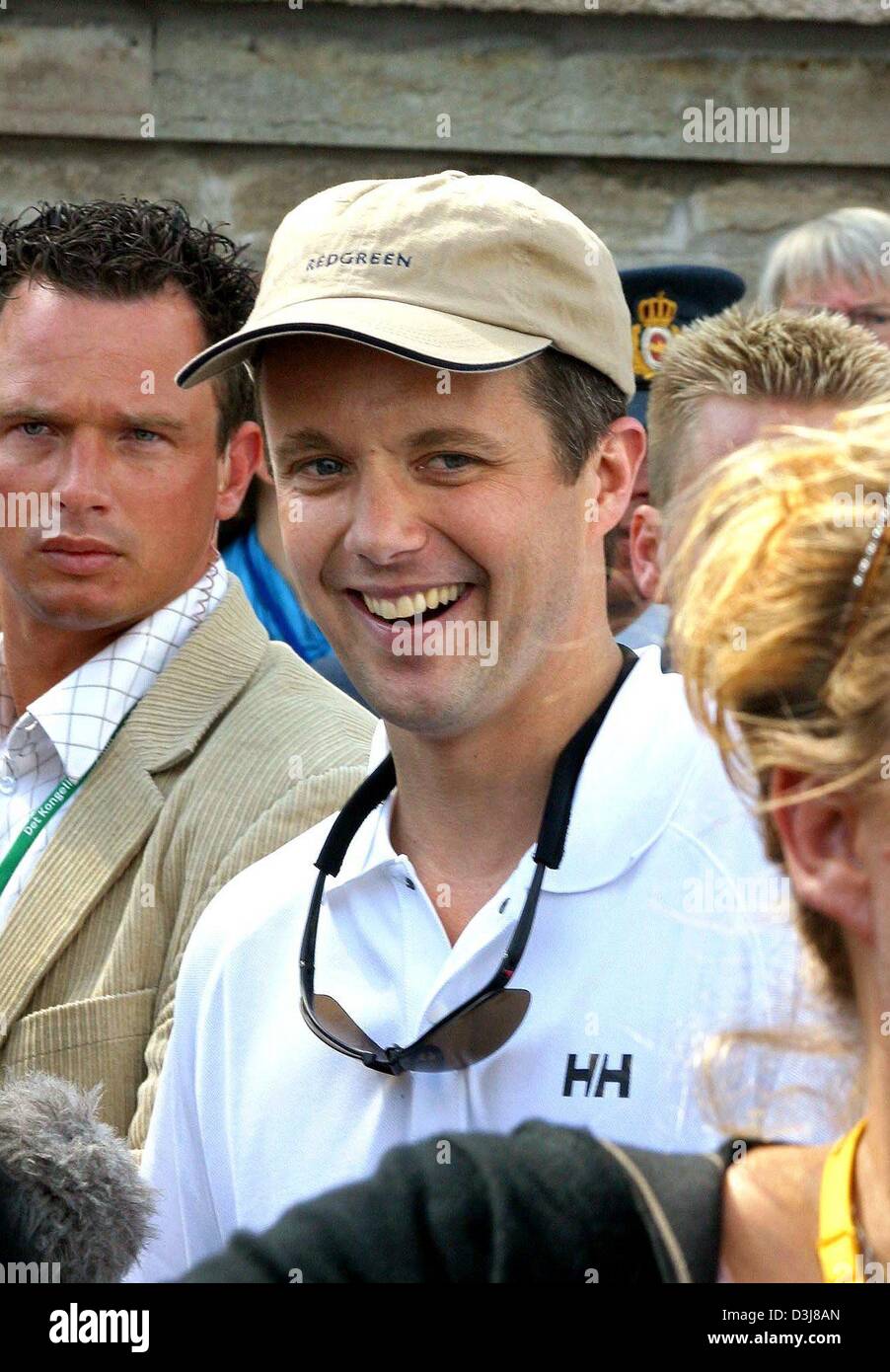 (dpa) - Crown prince Frederik of Denmark smiles after competing in a sailing regatta with his fiancee Mary Donaldson in the harbour of Copenhagen, Denmark, 9 May 2004. The sailing regatta which was eventually won by Mary. Stock Photo