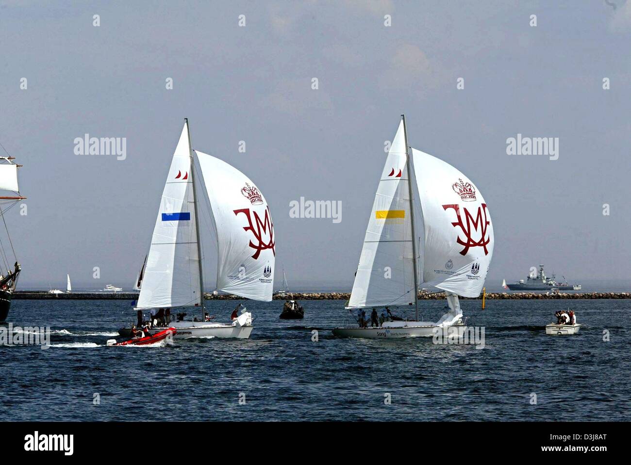 (dpa) - The sailing boats of Crown prince Frederik of Denmark and his fiancee Mary Donaldson compete with each other during a sailing regatta in the harbour of Copenhagen, Denmark, 9 May 2004. Mary and Frederik were competing with each other in a sailing regatta which was eventually won by Mary. Stock Photo