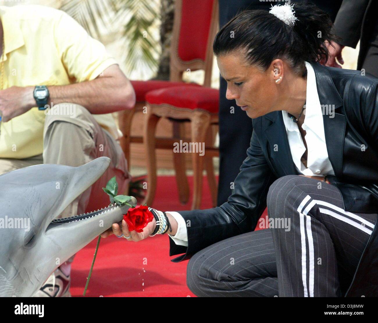 dpa) - Princess Stephanie of Monaco receives a rose from dolphin Magic whom  she had just baptized in the Connyland leisure park in Lipperswil,  Switzerland, 2 May 2004. The Princess came to
