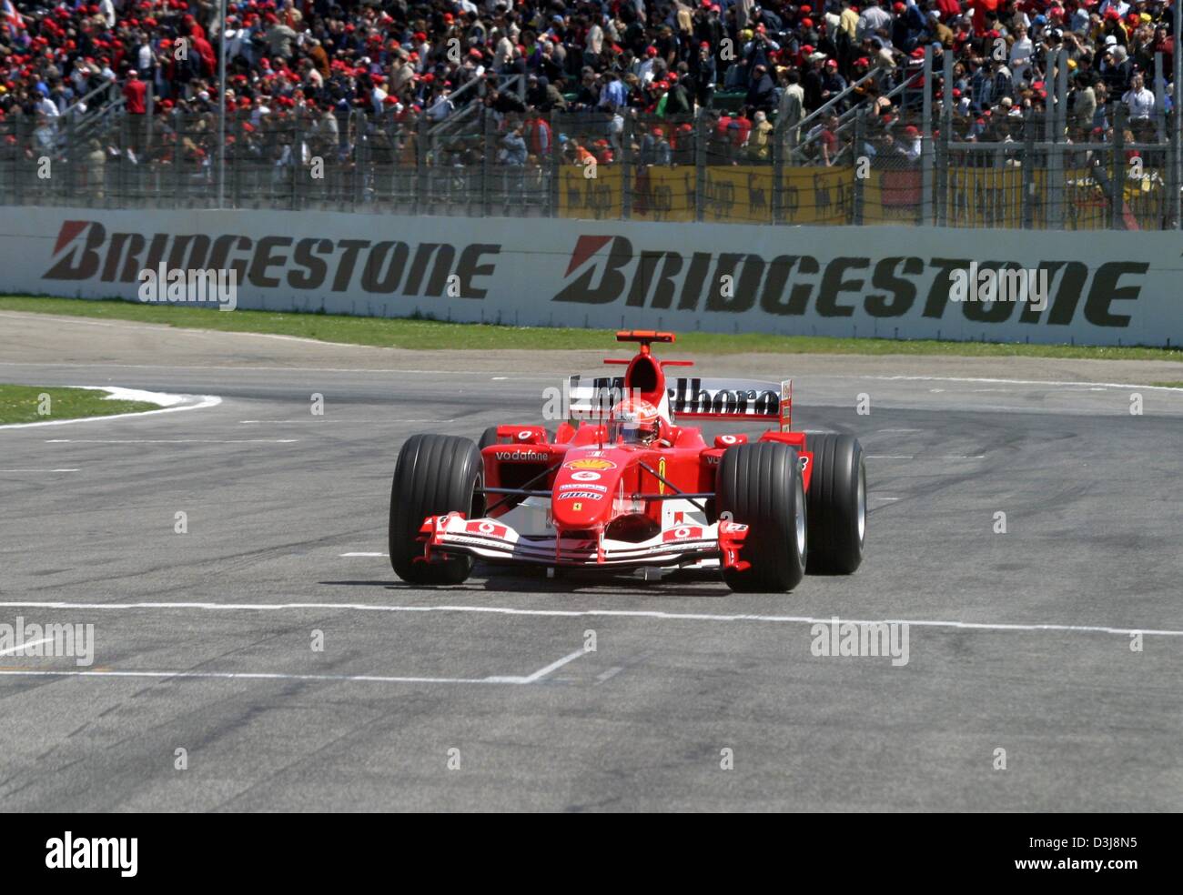 (dpa) - Michael Schumacher (Team Ferrari) races in the 2004 San Marino Grand Prix in Imola, Italy, 25 April 2004. He would go on to win the race. Stock Photo