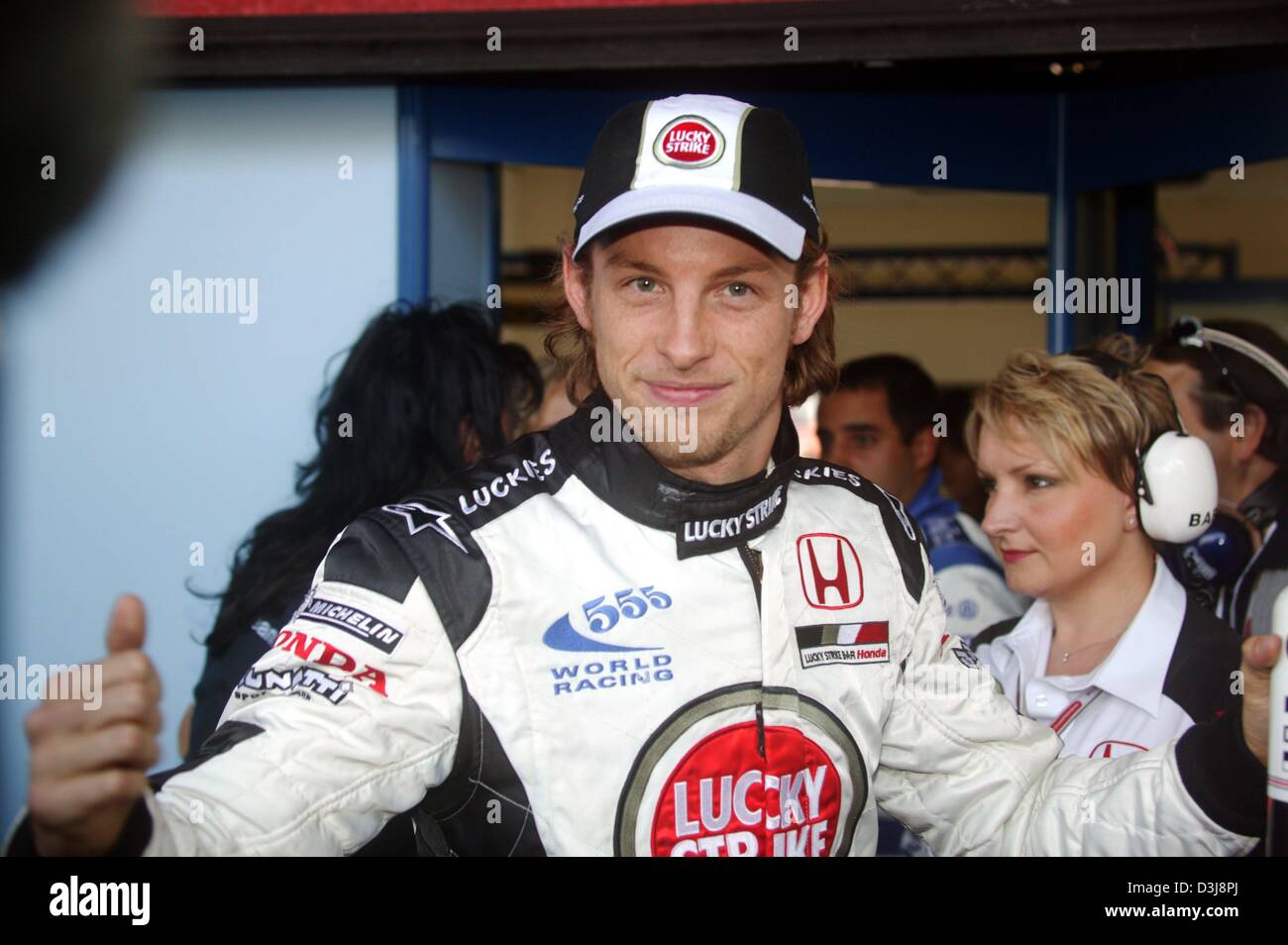 (dpa) - English Formula One pilot Jenson Button (Team BAR-Honda) smiles after winning his first ever pole position at the San Marino Grand Prix in Imola, Italy, 24 April 2004. Stock Photo