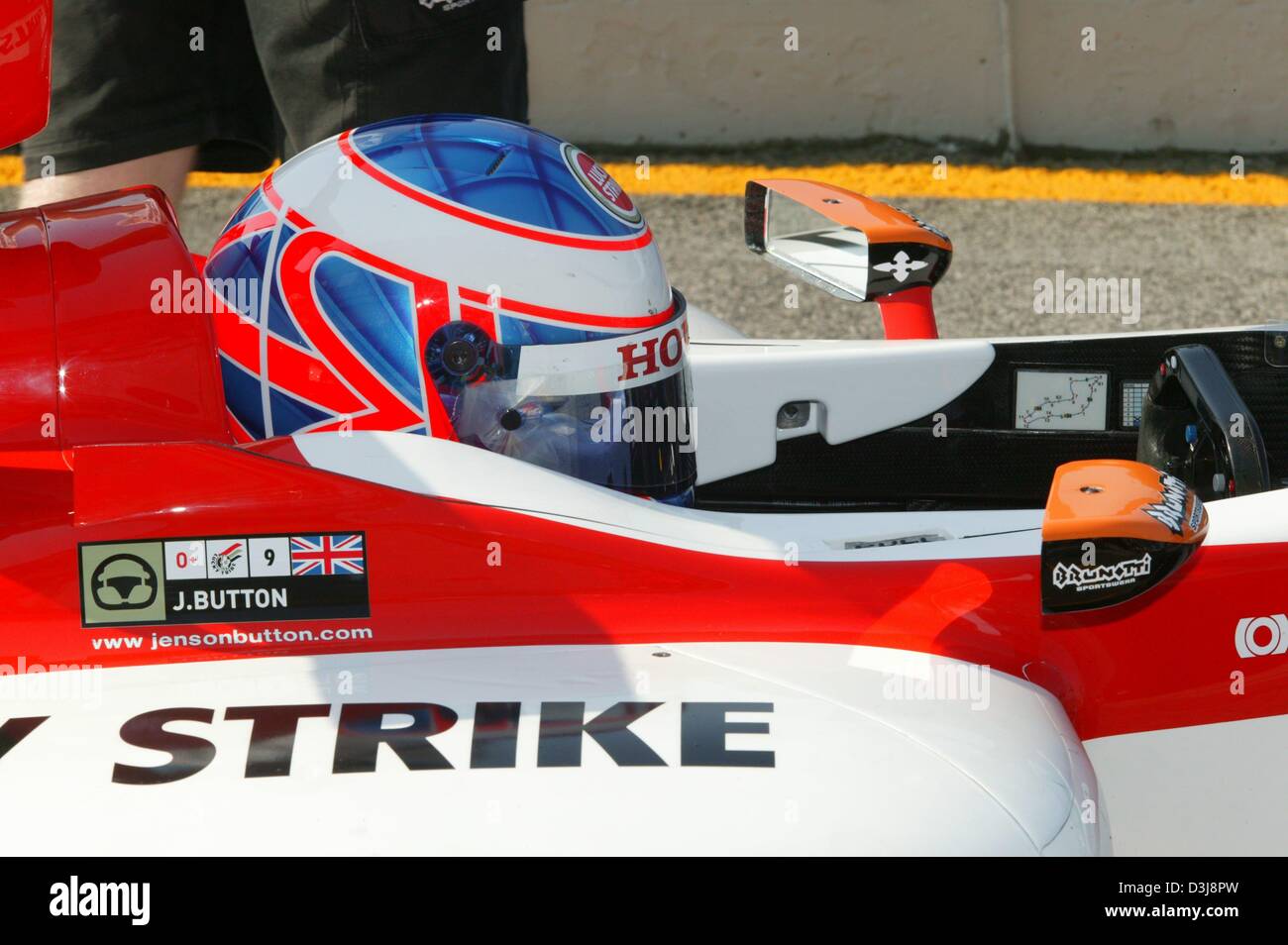 dpa English Formula One Pilot Jenson Button Awaits The Start Of The dpa English Formula One Pilot Jenson Button Awaits The Start Of The