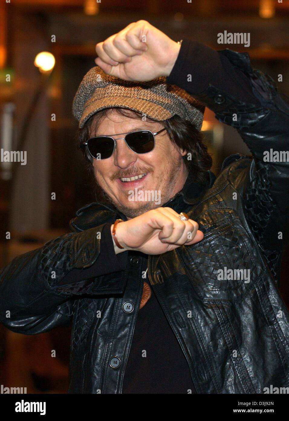 (dpa) - Italian musician, blues singer and song writer Zucchero smiles as he stand in a corridor of a hotel in Hamburg, Germany, 22 April 2004. 48-year-old musician promoted his new album which contains a collection of duets with international singers. The album, which took him 15 years to produce, will be officially introduced during a UN charity concert at London's Royal Albert H Stock Photo