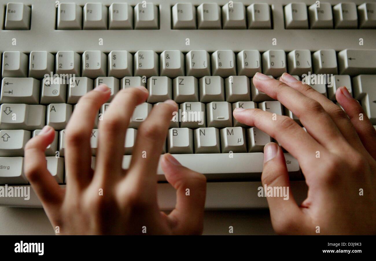 dpa) - Two hands type on a computer keyboard during a computing lesson in  Dietzenbach, Germany, 11 March 2004 Stock Photo - Alamy