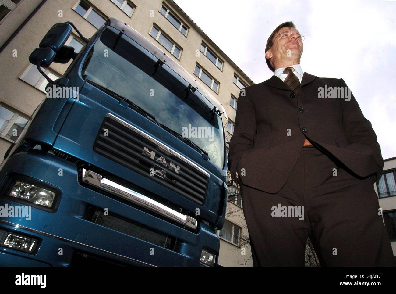 (dpa) - Hakan Samuelsson, chairman of MAN Nutzfahrzeuge AG German manufacturer of commercial vehicles, stands in front of a MAN TGA 18.430 truck before the start of the balance press conference in Munich, Germany, 22 March 2004.The company expects a revival in the commcerical vehicle business and an increase in turnover of more than five percent in the 2004 business year. The compa Stock Photo