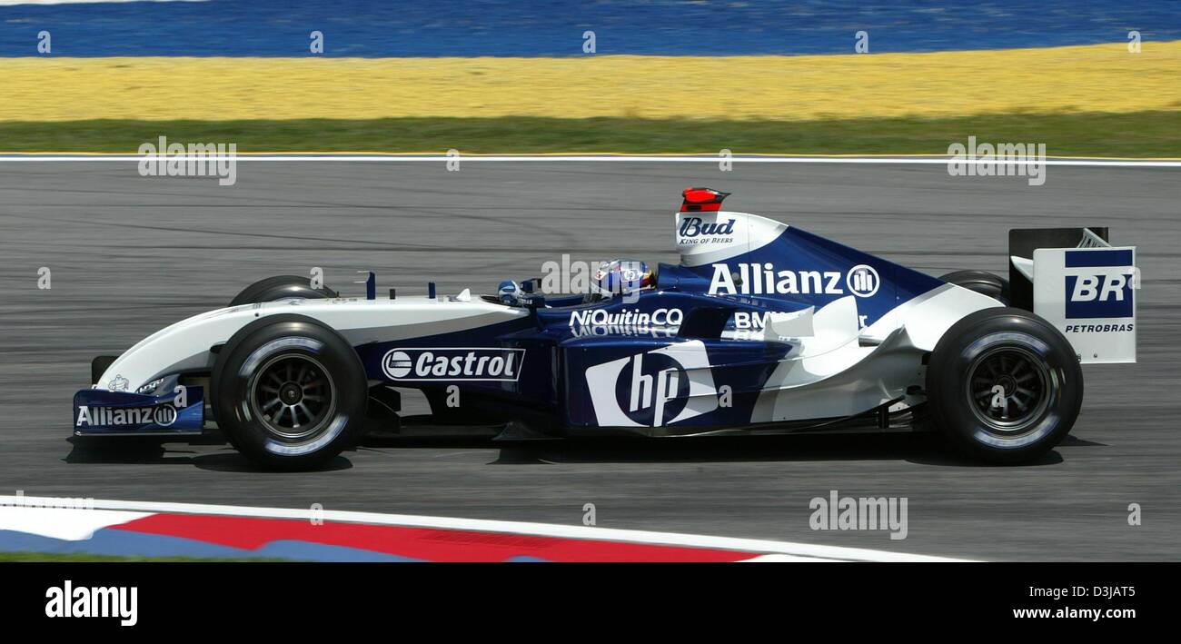 (dpa) The Colombian F1 pilot Juan Pablo Montoya (BMW Williams) races during the free training at the Sepang racetrack near Kuala Lumpur on Friday, 19 March 2004. On Sunday, 21 March 2004, the Grand Prix of Malaysia will be underway. Stock Photo