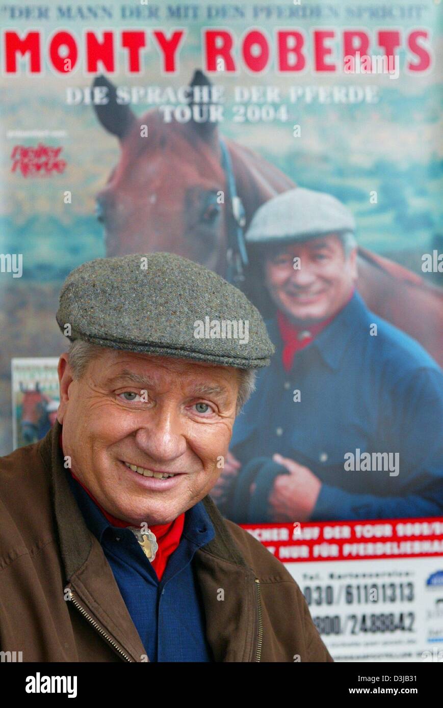 (dpa) - Monty Roberts, US horse trainer and author (a.o. The Language of Horses) stands in front of a poster which advertises him after an interview appointment in Berlin, 12 March 2004. Roberts, who is also known as 'The horse wisperer', started working with horses as an adolescent and became Rodeo champion later on. Eventually he became a renown specialists for horses, famous for Stock Photo