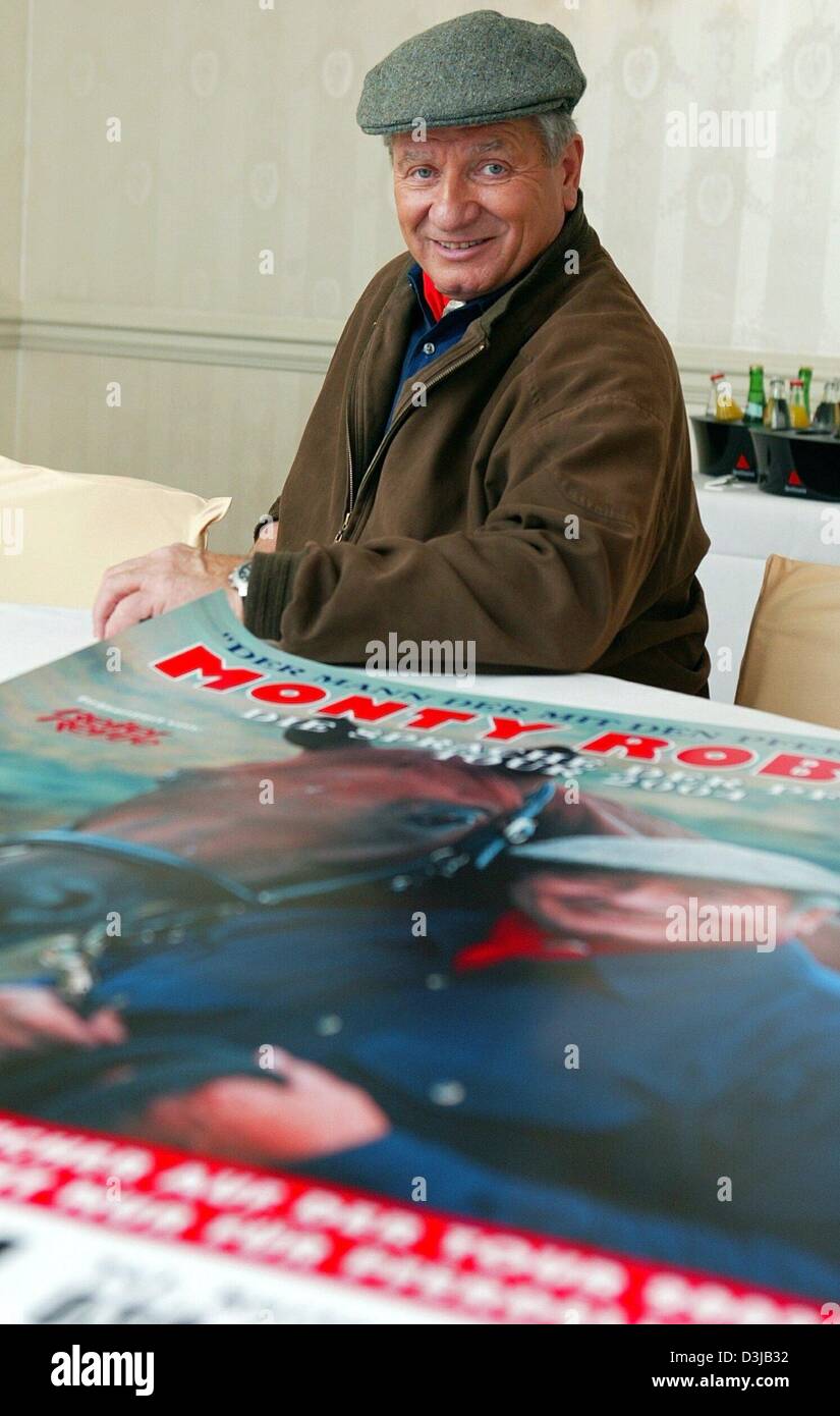 (dpa) - Monty Roberts, US horse trainer and author (a.o. The Language of Horses) stands behind a poster which lies on a table after an interview appointment in Berlin, 12 March 2004. Roberts, who is also known as 'The horse wisperer', started working with horses as an adolescent and became Rodeo champion later on. Eventually he became a renown specialists for horses, famous for his Stock Photo