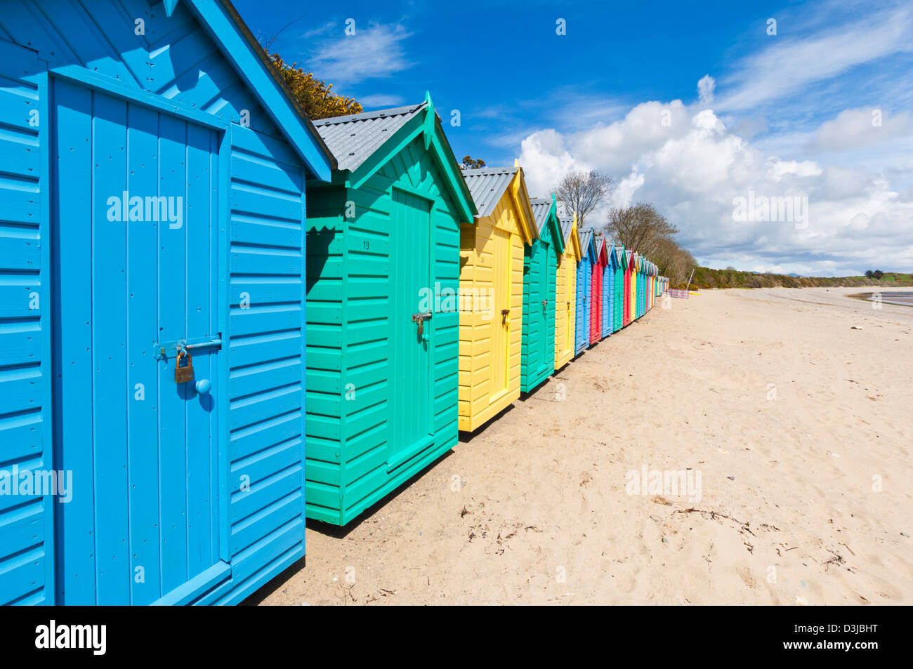 Bright painted beach huts on Llanbedrog beach Llyn peninsula Gwynedd North Wales UK GB EU Europe Stock Photo