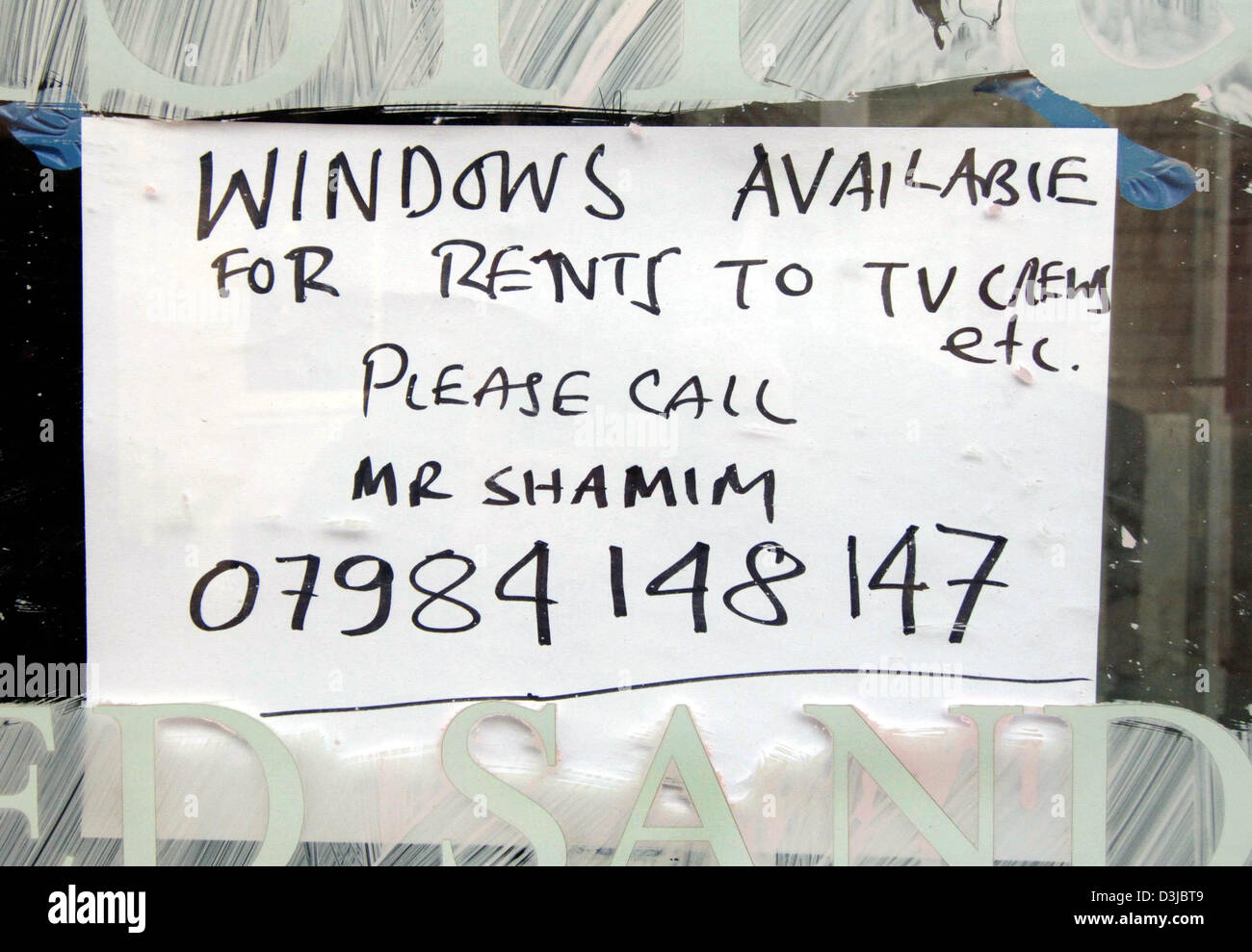 (dpa) - The owner of an insolvent restaurant wants to lure camera teams and photographers with this note into his rooms opposite the registry office in Windsor, England, Friday 08 April 2005. The British yellow press has paid for window places with direct view to the exit of the registry office up to 15,000 pounds. Prince Charles and Camilla Parker Bowles will get married here on S Stock Photo