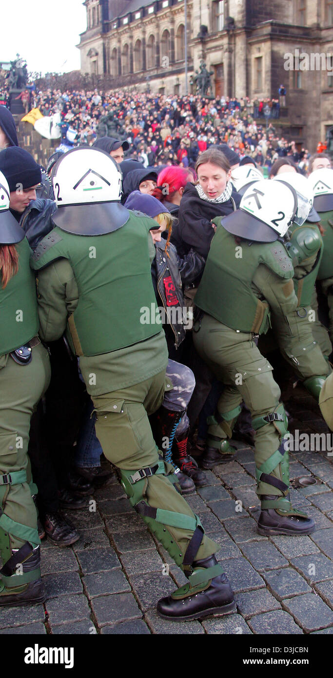 (dpa) - Police officer push back left wing protesters who tried to block a rally of the German right wing extremist party NPD in Dresden, Germany, 13 February 2005. The NPD and several hundred neo-Nazi skinheads gathered on the occasion of the 60th anniversary of the bombing raid on Dresden  during which an estimated 35,000 people died in the night from 13 February to 14 February 1 Stock Photo