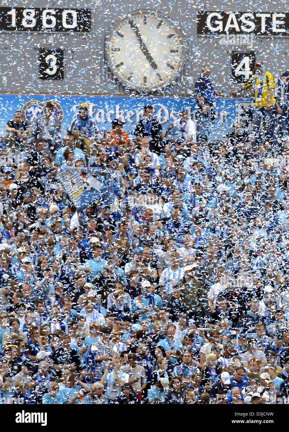 (dpa) - Supporters of Second Bundesliga club TSV 1860 Munich throw confetti after the referee's final blow into the whistle at the Gruenwalder stadium in Munich, Germany, 22 May 2005. Stock Photo
