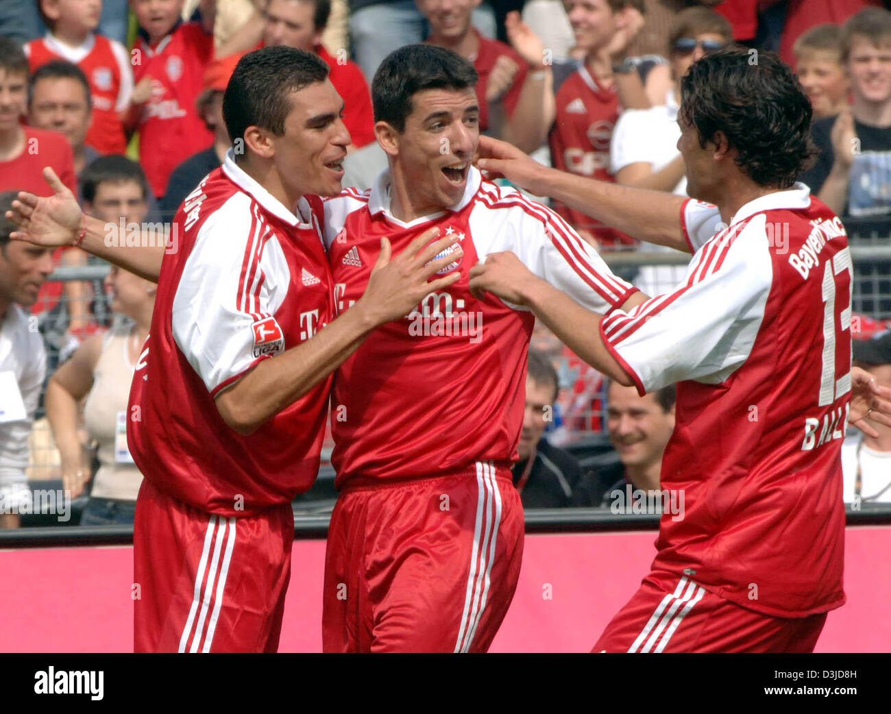 (dpa) - FC Bayern Munich's Lucio, Roy Makaay and Michael Ballack (from L-R) celebrate a goal during the German Bundesliga match against 1. FC Nuremberg at the Olympic stadium in Munich,  Germany, 14 May 2005. Stock Photo