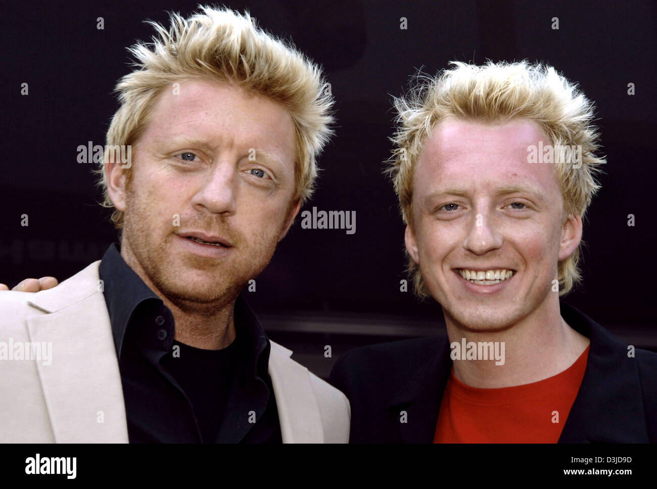 (dpa) - German tennis legend Boris Becker (L) and his look-alike Maik Lohmann smile at the ATP Tennis Masters in Hamburg, Germany, Friday 13 May 2005. Becker is the tournament's chairman. Lohmann plays Becker's look-alike in a German TV ad. Stock Photo