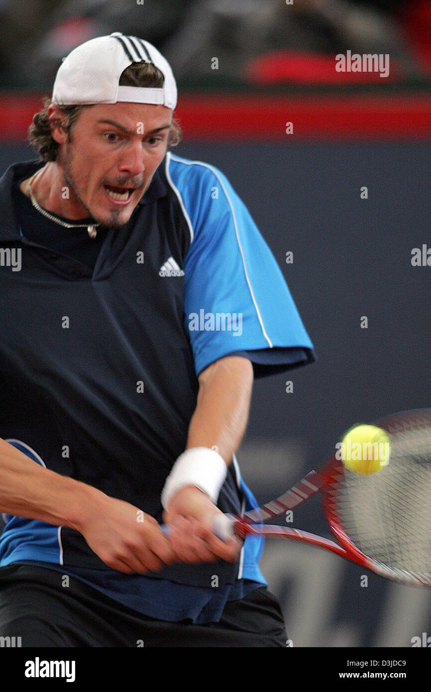 (dpa) - Russian tennis pro Marat Safin returns the ball during his match against Spanish Juan Carlos Ferrero at the ATP Tennis Master Tournament in Hamburg, Germany, 11 May 2005. The seeded Safin lost the match against the unseeded Ferrero 4-6 and 2-6. Stock Photo