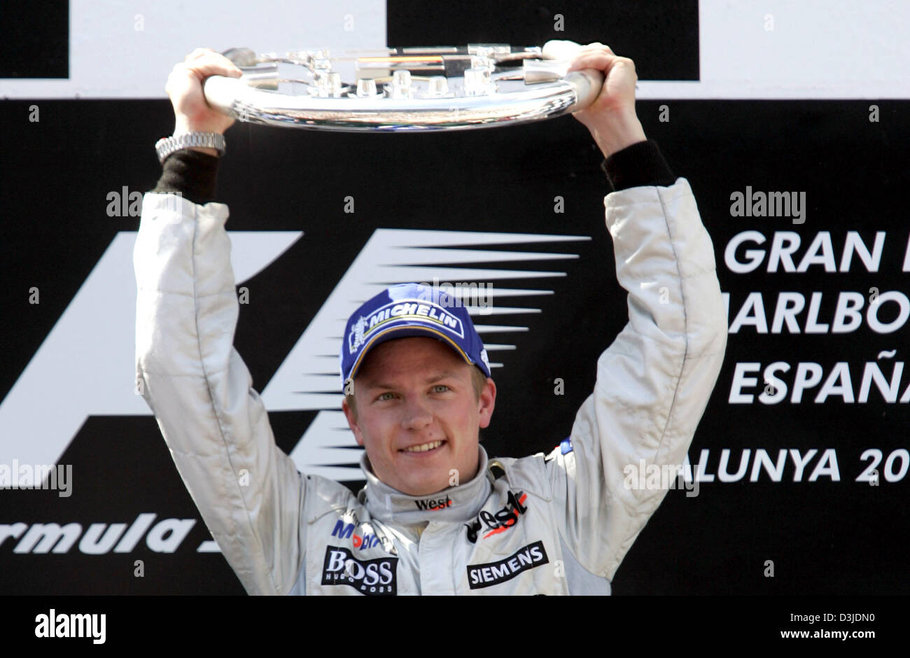(dpa) - Finnish Formula One driver Kimi Raeikkoenen of team McLaren Mercedes celebrates his victory at the Grand Prix of Spain at the Formula One racetrack Circuit de Catalunya close to Barcelona in Montmelo, Spain, Sunday 08 May 2005. Stock Photo
