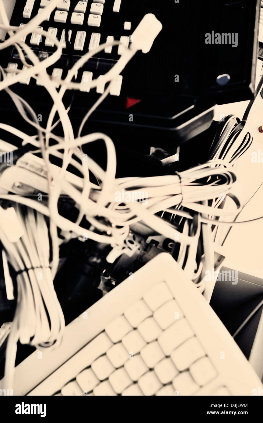 Electronic waste disposal with wiring and keyboards and old phone systems Stock Photo Alamy
