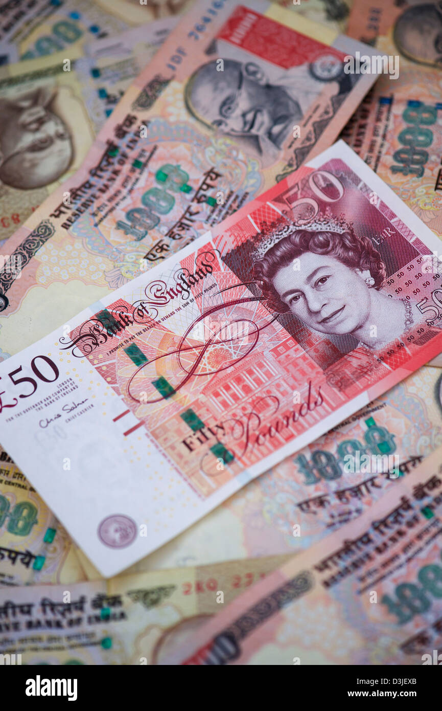 British and Indian currency. Sterling and Rupee notes Stock Photo