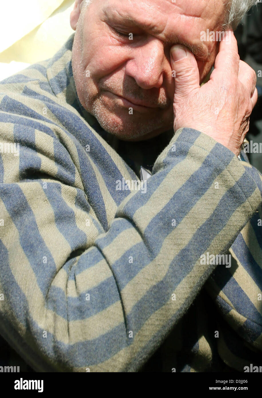 (dpa) - A concentration camp survivor cries as he participates in a ceremonial act at the memorial site of former Sachsenhausen concentration camp near Oranienburg, Germany, 17 April 2005. The memorial service commemorated the 60th anniversary of the liberation of camp Sachsenhausen. Stock Photo