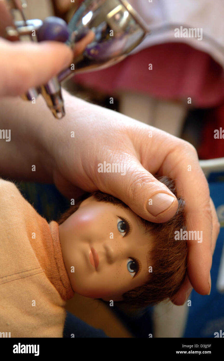 (dpa) A doll's cheeks is being painted handly at the of