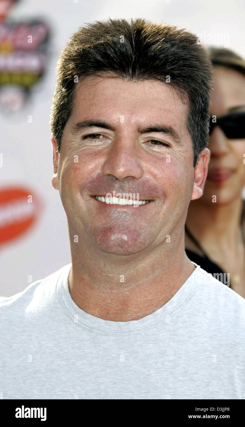 (dpa) British television host and celebrity Simon Cowell smiles as