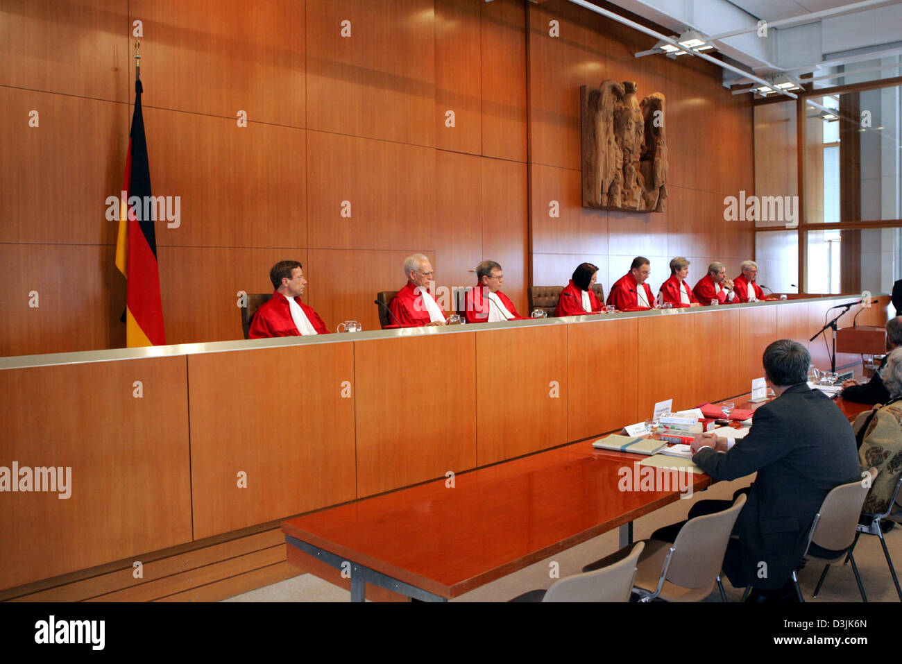 (dpa) - The members of the first senat of the Federal Administrative Court (BVG), (from L) Judges Reinhard Gaier, Wolfgang Hoffmann-Riem, Dieter Hoemig, Christine Hohmann-Dennhardt, Hans-Juergen Papier (chairman) Evelyn Haas, Udo Steiner and Brun-Otto Bryde open the legal proceedings in Karlsruhe, Germany, 15 March 2005. The first senat of the BVG is examining under which requireme Stock Photo
