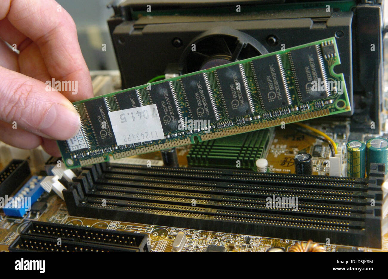 pic Computer Hardware Memory Card Computer https www alamy com stock photo dpa a hardware technician builds a memory card into the memory slot 53885348 html