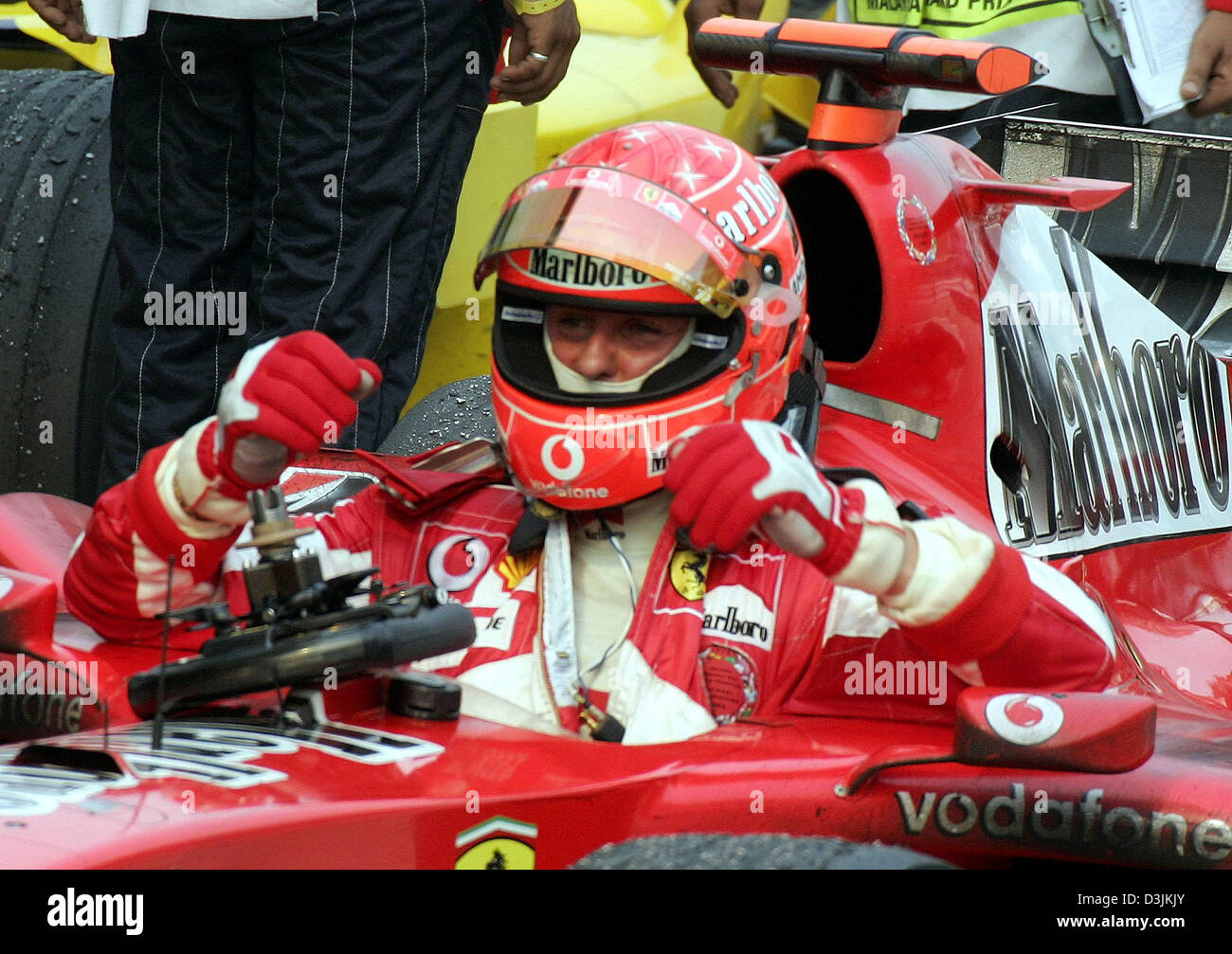 (dpa) - German Formula One driver Michael Schumacher gets out of his