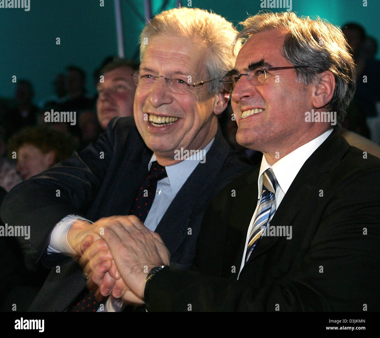 (dpa) - Bremen's governing mayor Henning Scherf (L) and Josef Kind, President of EADS Space Transportation Germany, cheer after the launch of the Ariane 5 rocket at the EADS conference center in Bremen, Germany, 12 February 2005. The rocket was launched from the space centre in Kourou, French Guyana. Stock Photo