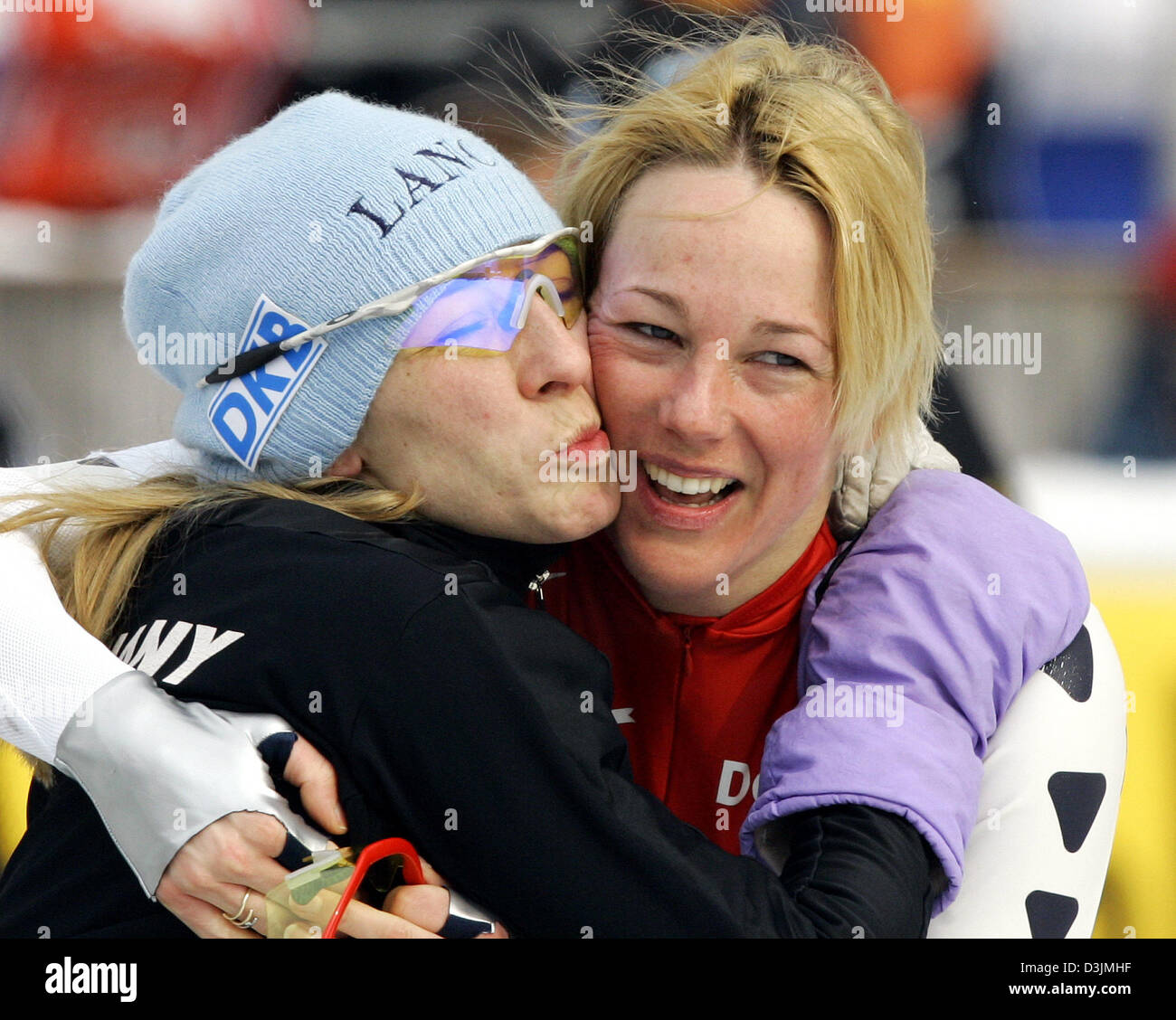 (dpa) - German speed skater Anni Friesinger (L) and Dutch speed skater Marianne Timmer congratulate themselves after finishing in second and third place respectively in the Women's 1000 meter race at the Speed Skating World Championship in Inzell, Germany, 6 March 2005. Stock Photo