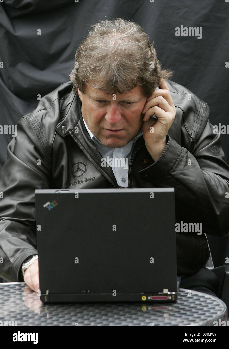 (dpa) - German Norbert Haug, Mercedes Motorsport Director, looks at his computer at the Grand Prix circuit in Albert Park in Melbourne, Australia, 4 March 2005. The first Grand Prix of the 2005 season will start on 6 March 2005. Stock Photo