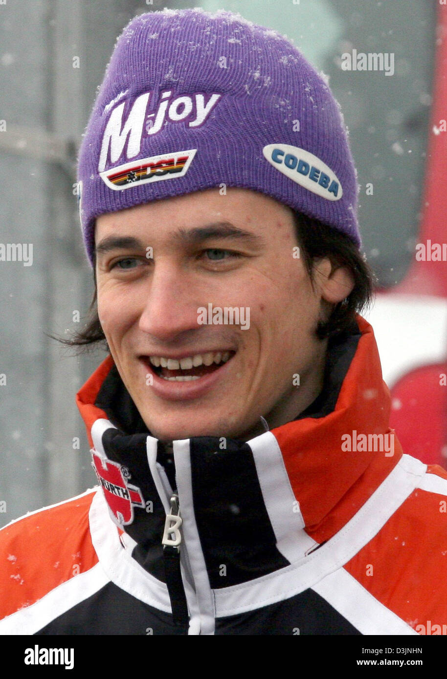 dpa) - German ski jumper Martin Schmitt smiles on the sidelines of