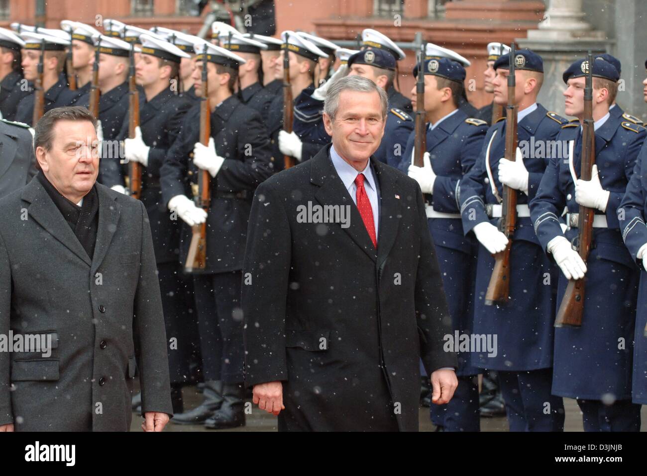 (dpa) - US President George W. Bush is greeted with military honours while German Chancellor Gerhard Schroeder stands next to him at the courtyard of the electoral castle in Mainz, Germany, 23 February 2005. Bush and Schroeder want to set up goals for the future German American collaboration. Stock Photo