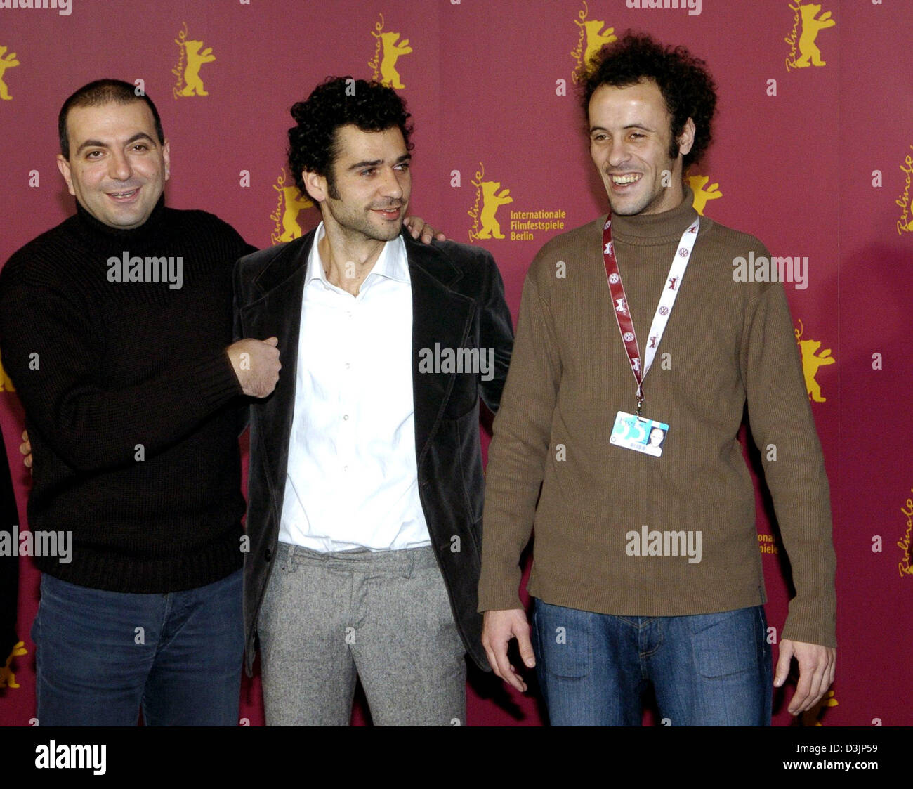 (dpa) - Palestinian director Hany Abu-Assad (L) stands next to his two main actors Kais Nashif (C) and Ali Suliman during the press conference for their movie 'Paradise Now ' at the Berlinale Filmfestival in Berlin, Germany, 14 February 2005. The German-Dutch-French production centres around a young Palestinian woman and the search for her groom. Stock Photo