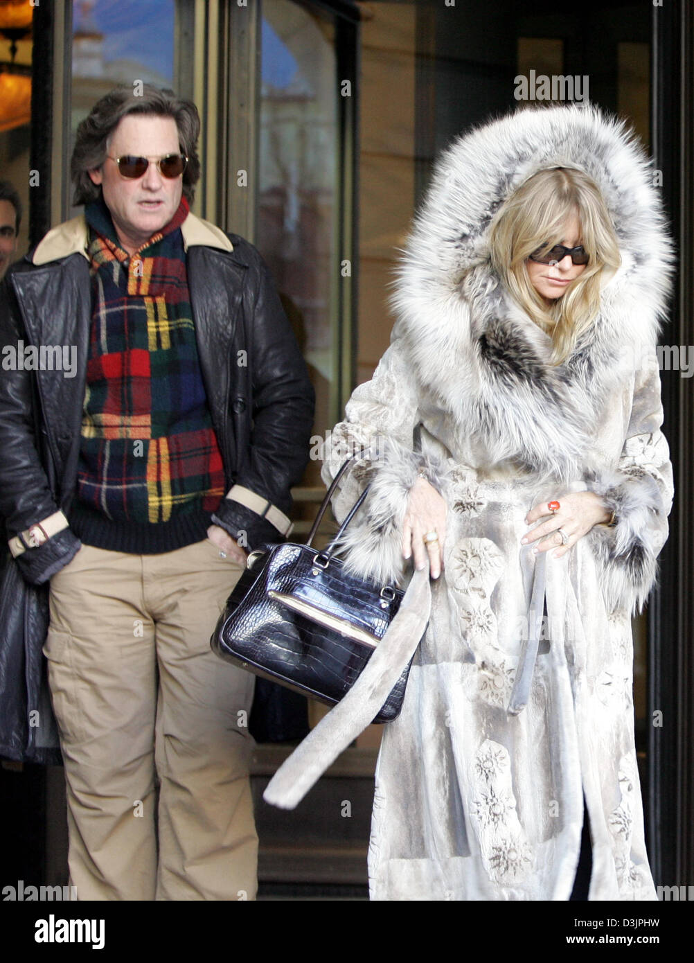 (dpa) - US actress Goldie Hawn (R) and her husband and fellow actor Kurt Russell leave the Hotel Adlon in Berlin, Germany, 8 February 2005. Hawn will be presented with the 'Goldene Kamera' award on 9 February 2005 in the German capital. Stock Photo