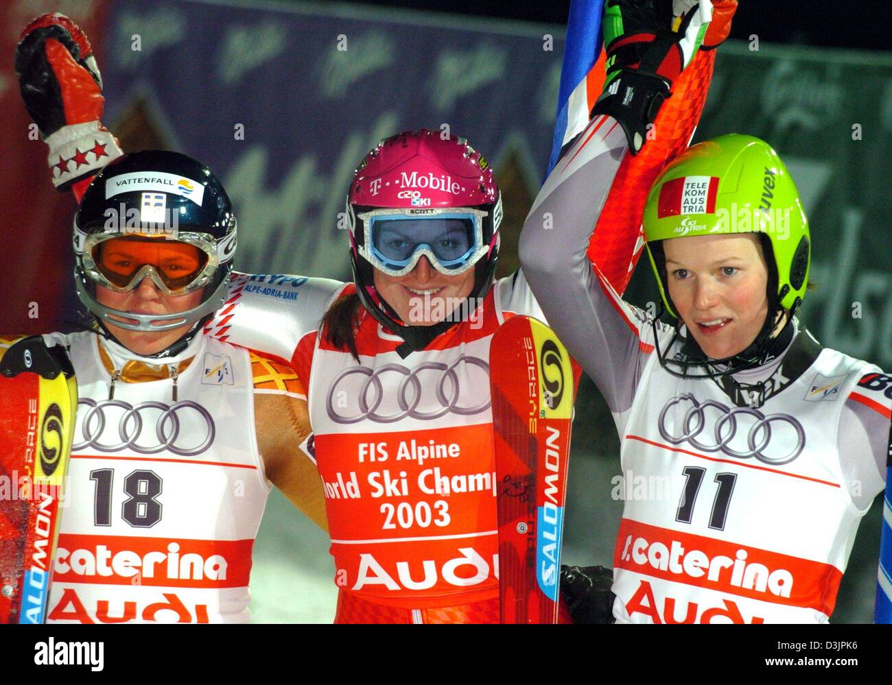 (dpa) - Croatian skier Janica Kostelic (C), Austrian skier Marlis Schild (R) and Swedish skier Anja Paerson cheer and smile after the Women's Slalom Combined at the Alpine Skiing World Championships in Santa Caterina, Italy, 04 February 2005. Kostelic won gold and the world champion title, Paerson won silver and Schild took bronze. Stock Photo