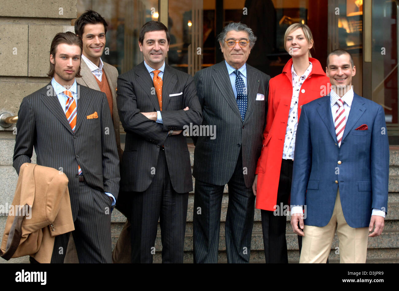 dpa) - Ciro Paone (C), owner and founder of Italian fashion company Kiton,  gives the thumbs up sign while he presents together with Antonio de Matteis  (3rd from L), the company's chief