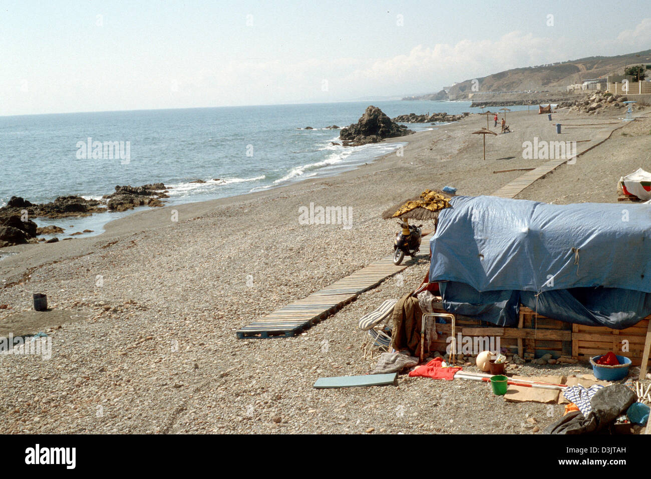 (dpa) - A view of a tent set up on the beach by refugees along the coast in the Spanish exclave of Ceuta, 9 September 2004. The harbour town of Ceuta at the north western tip of Morocco belongs to Spain since 1580. Stock Photo