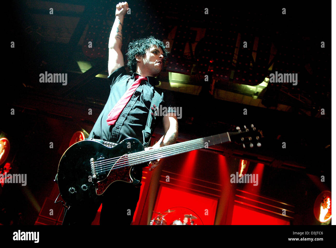 (dpa) - Billie Joe Armstrong, lead singer of US punk rock band Green Day performs during the band's concert at the Arena in Berlin, Germany, 11 January 2005. The Berlin concert kicked off Green Day's European tour. Stock Photo