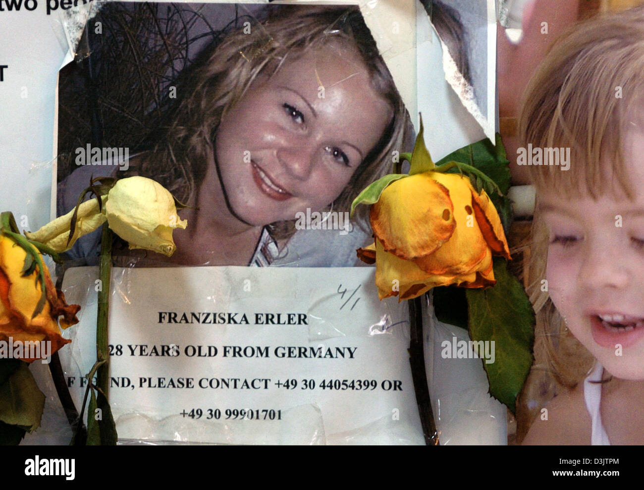 (dpa) - A photo of German tourist Franziska Erler which is decorated with roses is posted amongst several hundred other special announcements for missing people at a hospital in Phuket, Thailand, Friday 7 January 2005. According to official numbers 5,291 people died in Thailand alone during South Asia's flood disaster. Stock Photo