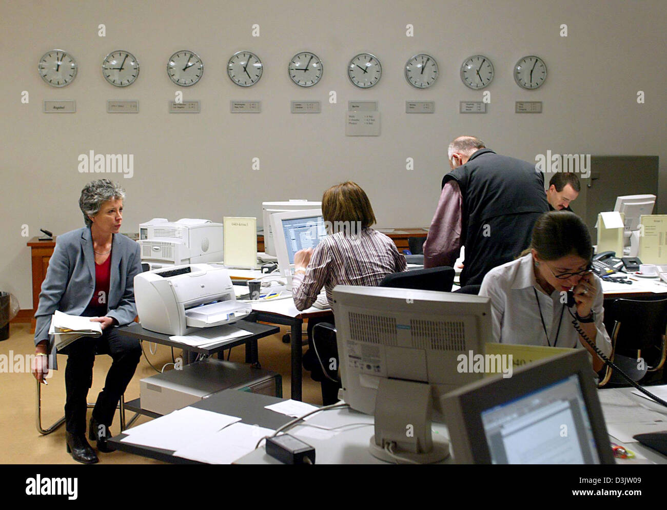 (dpa) - Members of the crisis team sit in front of computer screens and telephones at the centre for crisis management at the German Foreign Office in Berlin, on Tuesday 4 January 2005. Fisher and his colleagues deliberated on the current situation in Southeast Asia after the tsunami disaster. Stock Photo