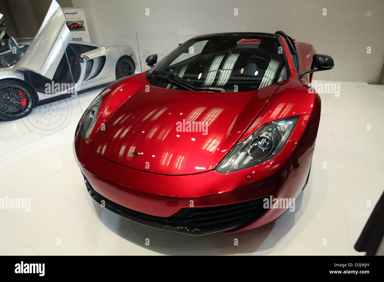 shiny red sports car show room Stock Photo